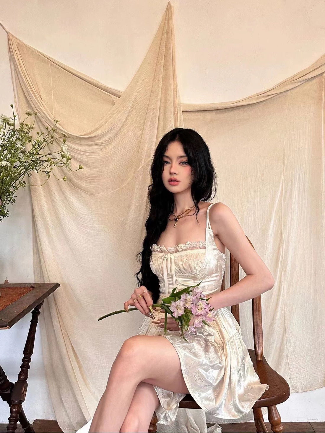 Cream mini fairycore dress with lace corset and square neckline.