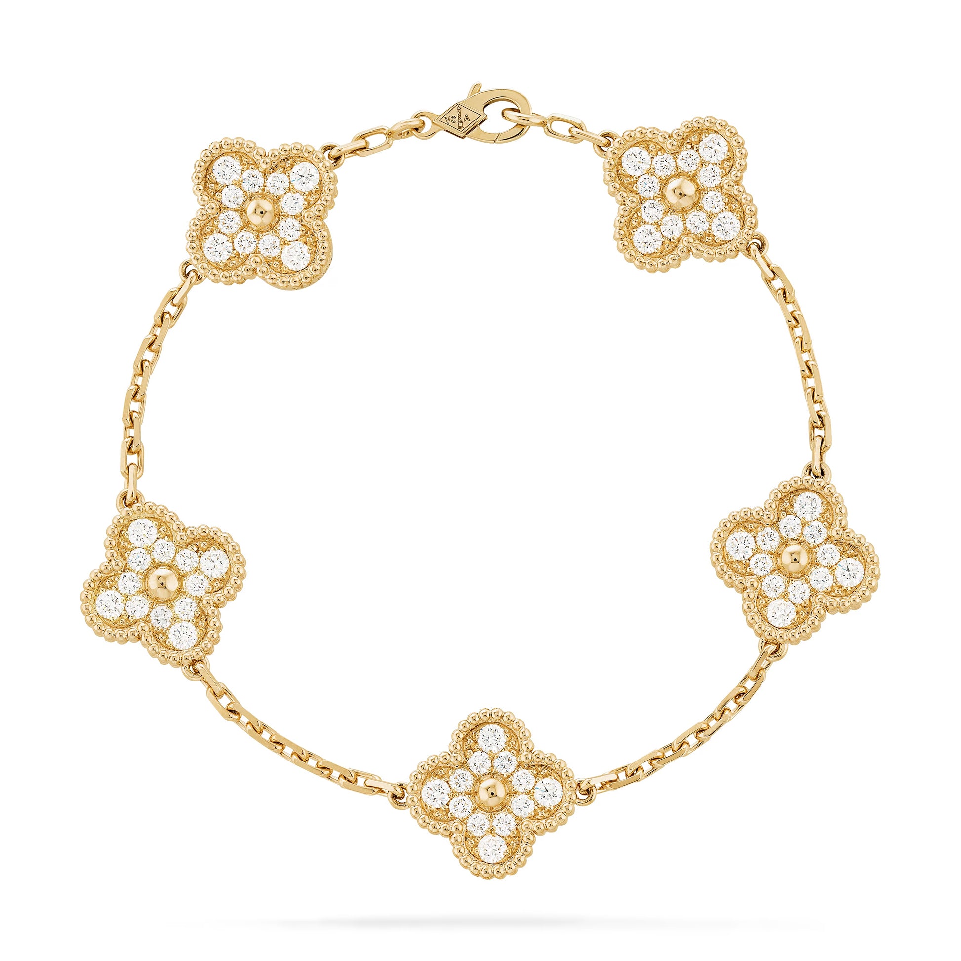 Elegant wrist styling featuring the Clover, Nail, Love, and Tennis bracelets combined for a cohesive fashion statement.