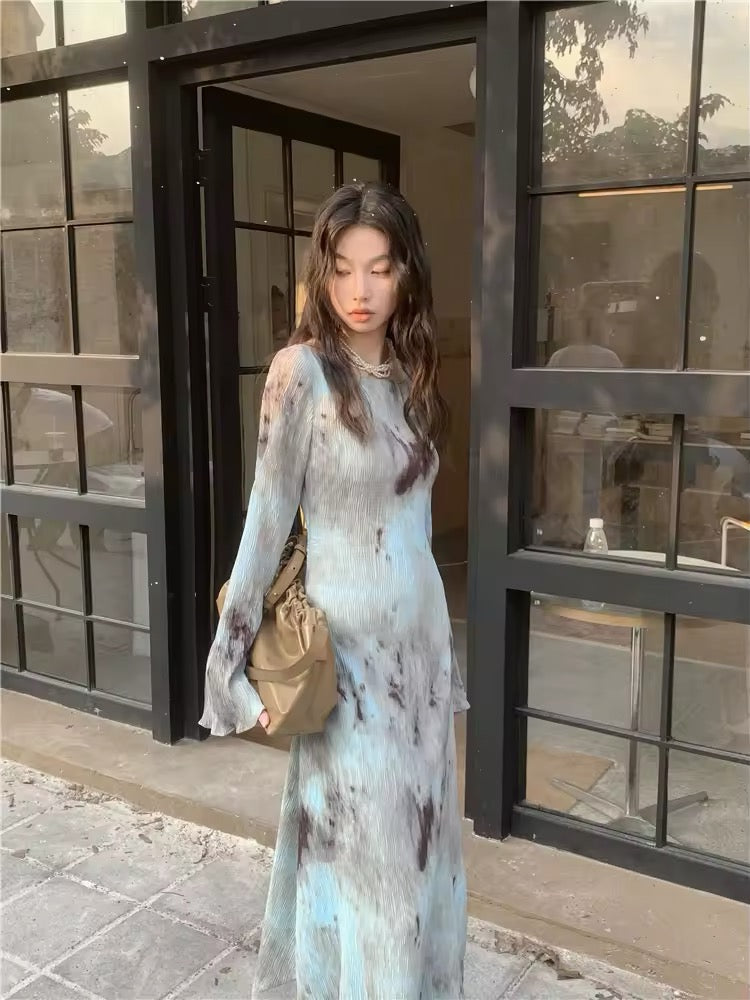 Tie dye flare maxi dress with long sleeves, displayed on a mannequin