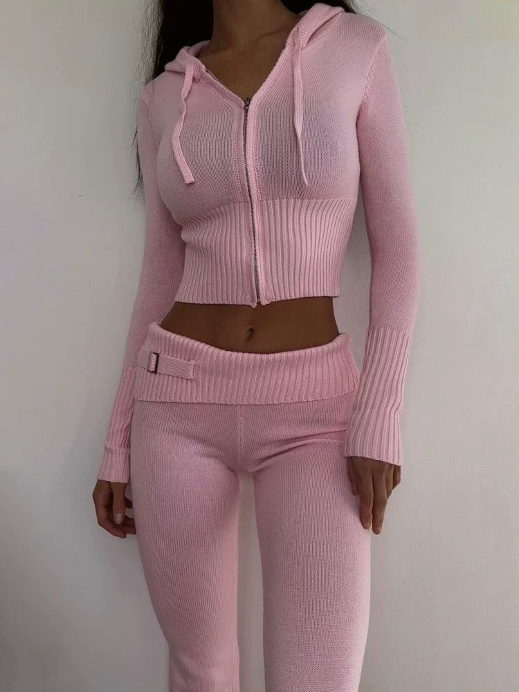 Woman posing in pink Y2K tracksuit for Instagram look