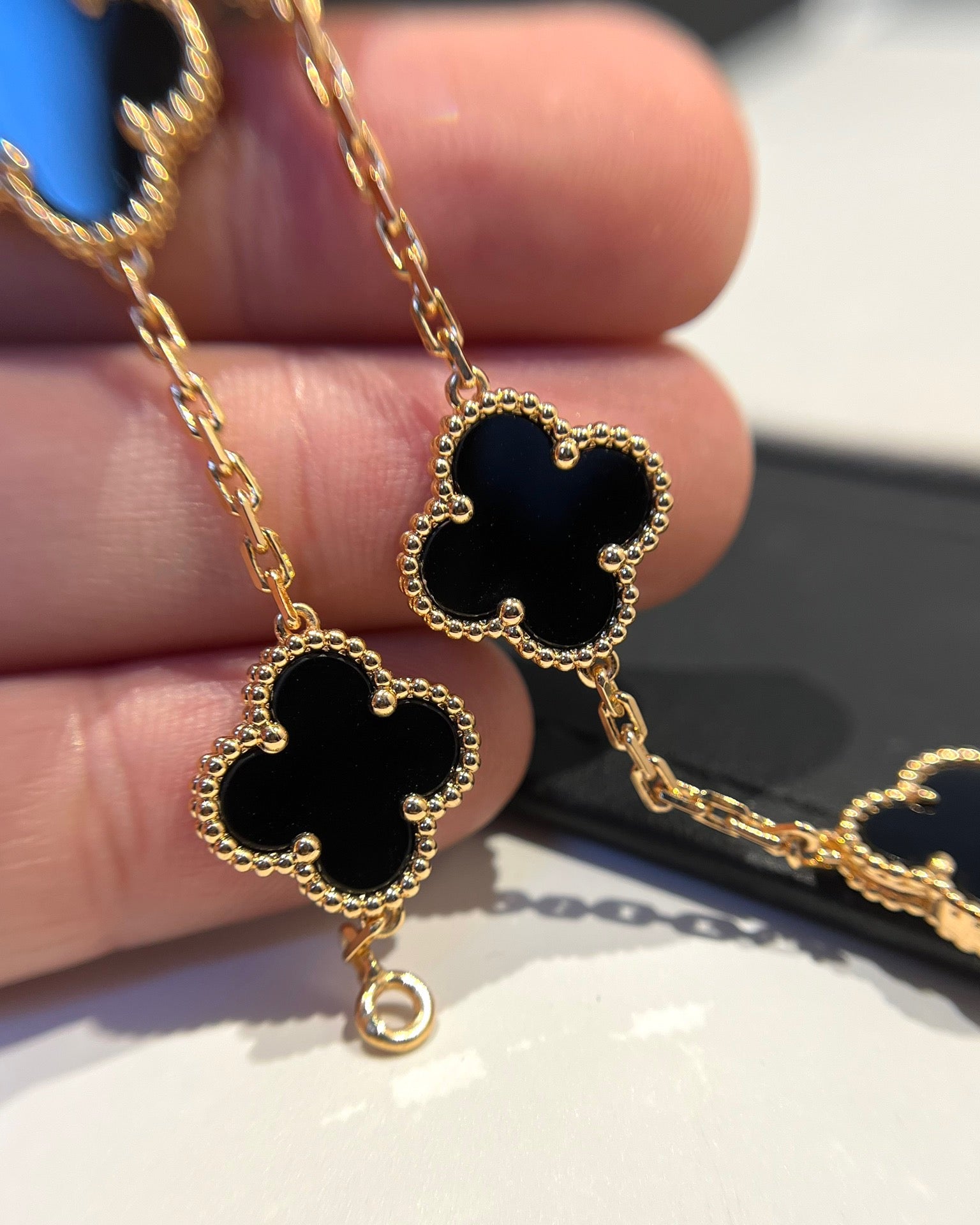 Designer charm bracelet with black clover and waterproof design