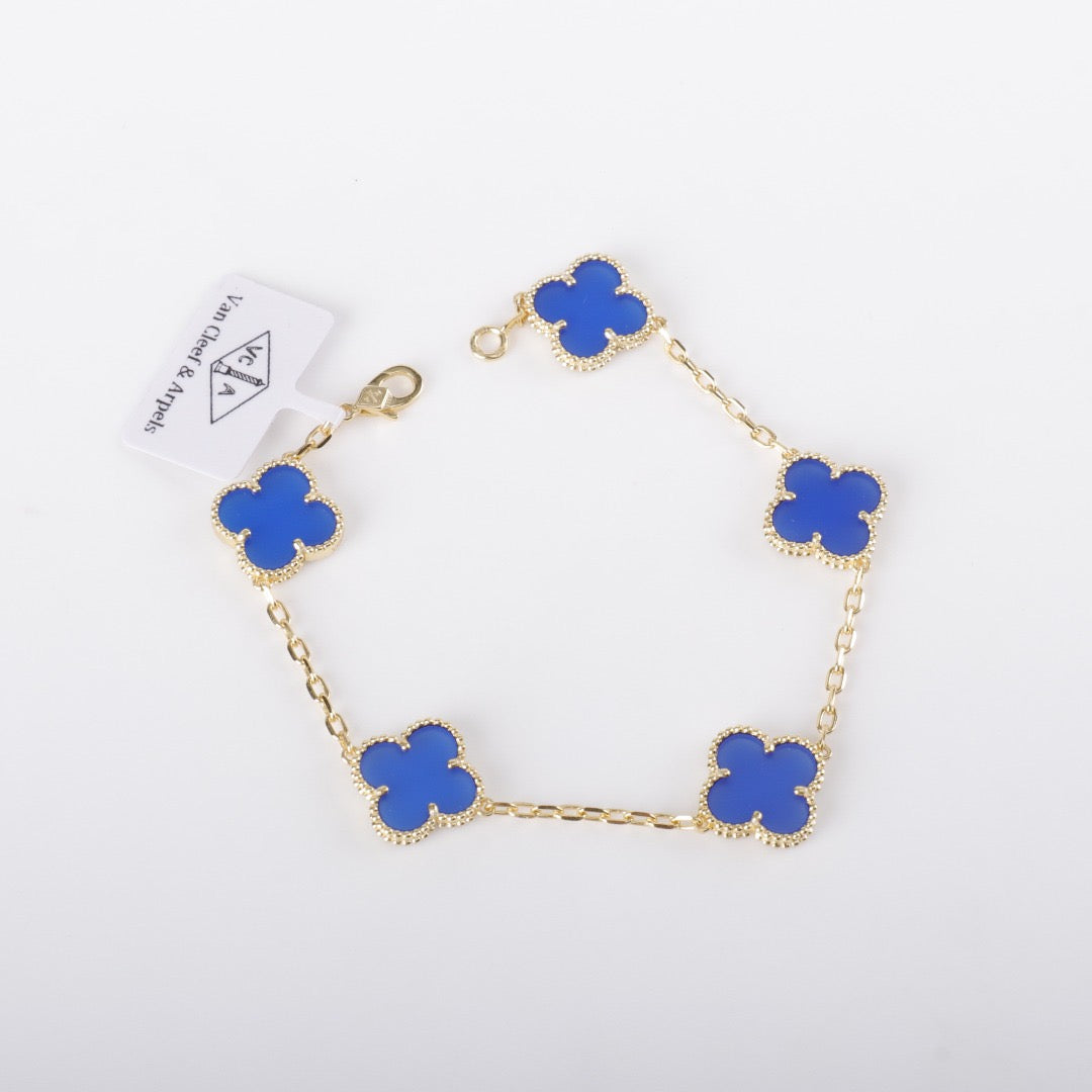 Blue clover bracelet with gold plating and soft enamel charm