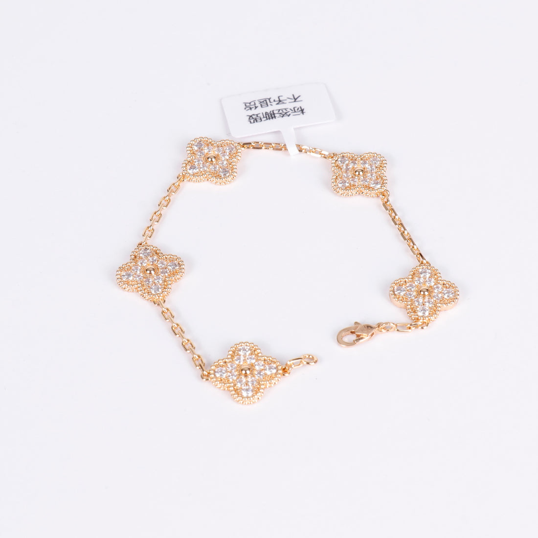 Crystal clover bracelet in 18K gold with sparkling detail