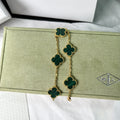 Elegant four-leaf clover charm bracelet in green and gold