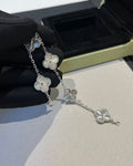 Elegant four-leaf clover charm bracelet in 18K white gold