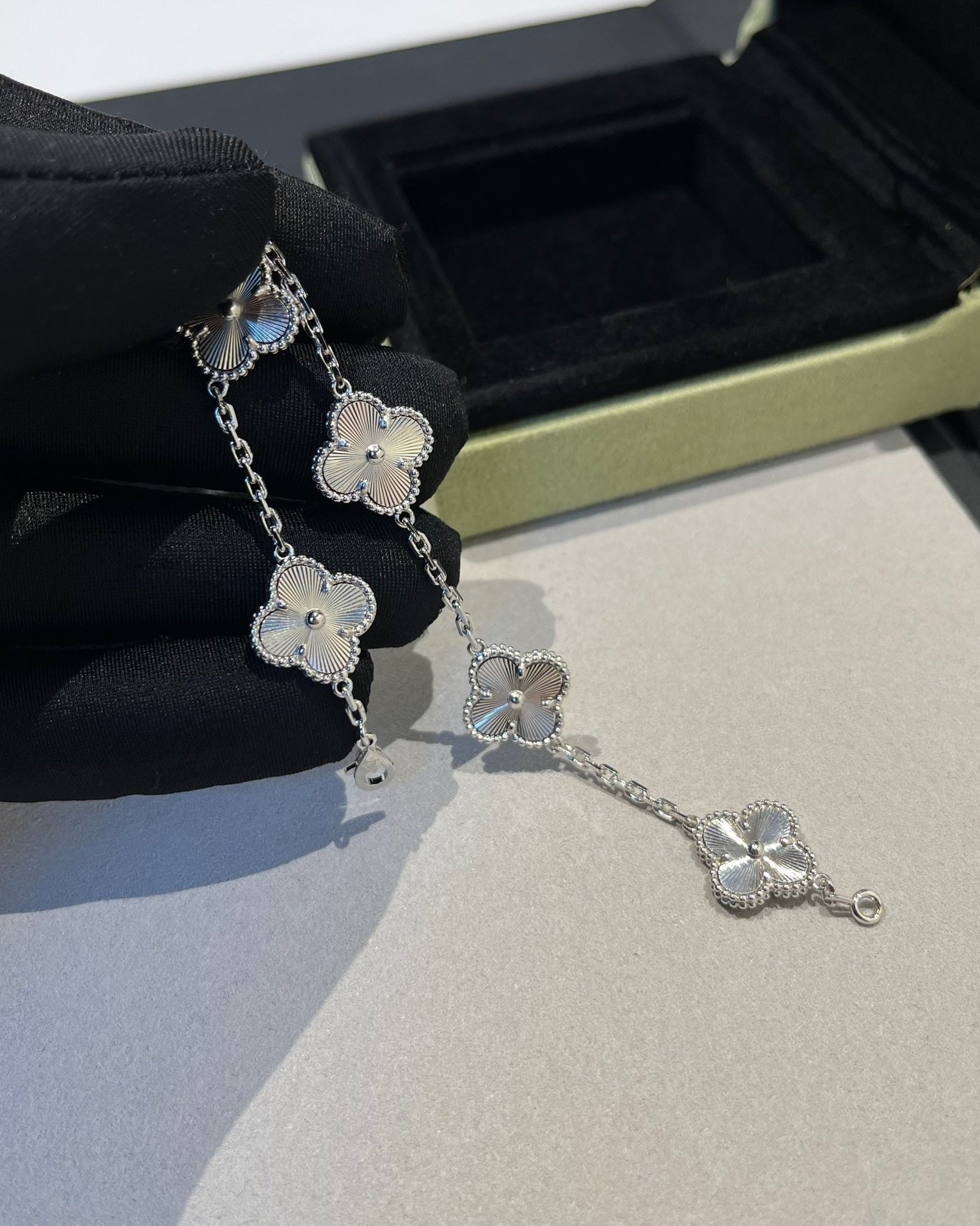 Elegant four-leaf clover charm bracelet in 18K white gold