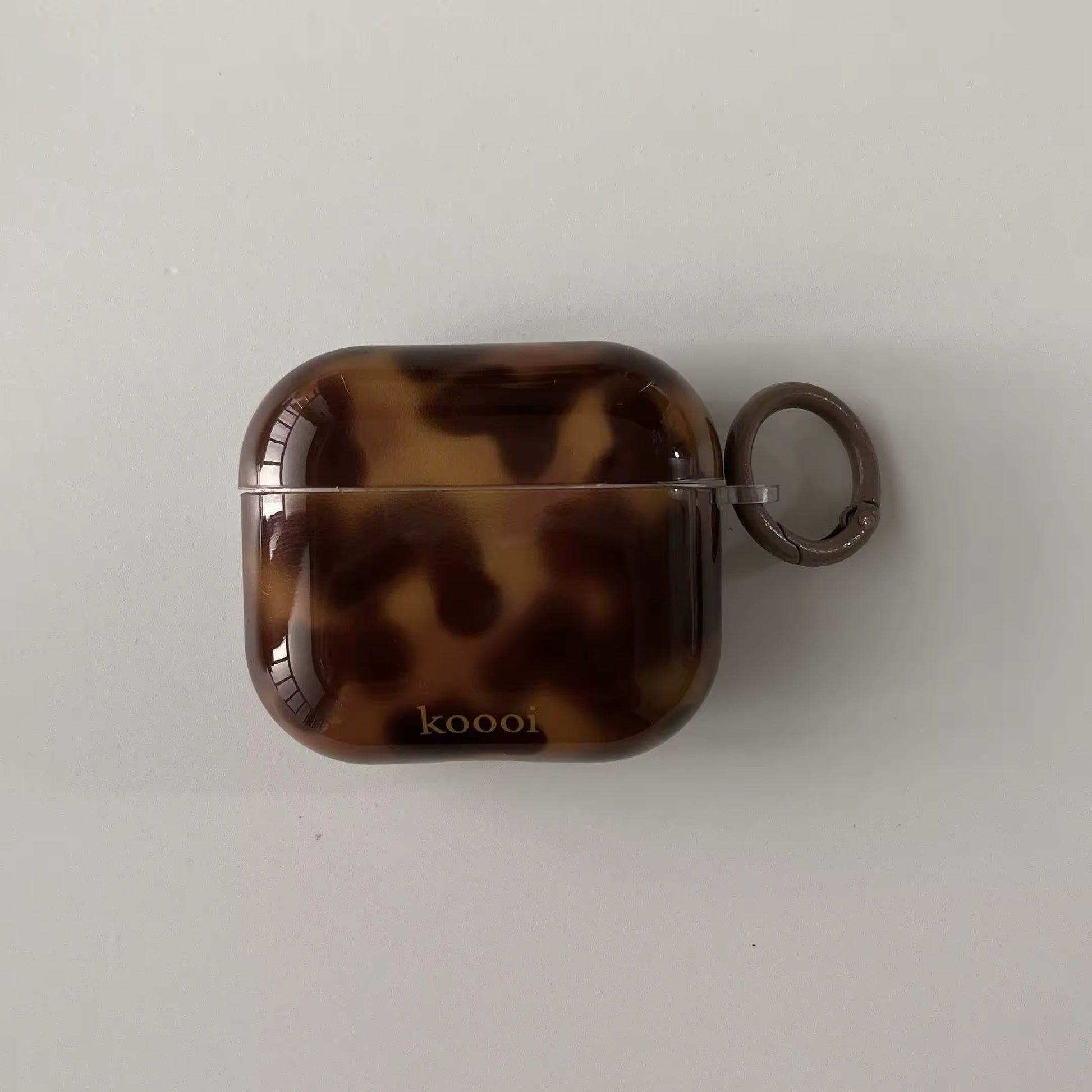 Elegant earphone case in amber brown swirl