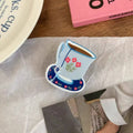 Strong grip floral mug hair claw for thick and fine hair
