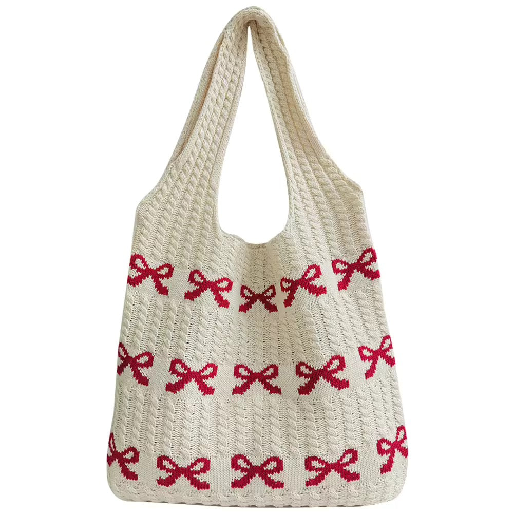 Front view of the Soft Girl Beach Bag showcasing the intricate knitted bow pattern.