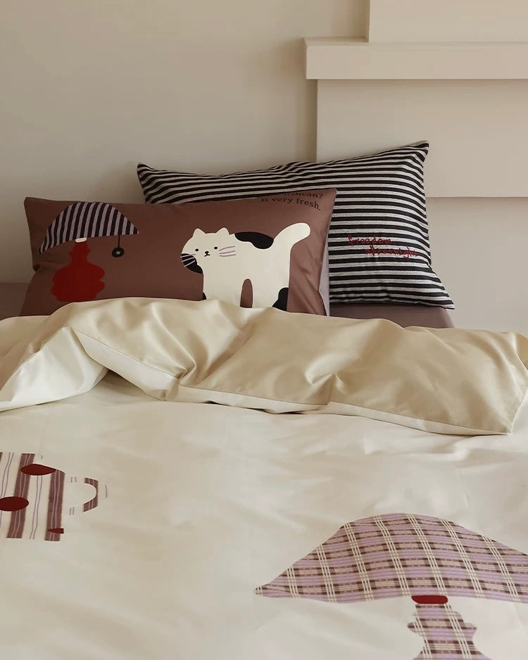Children's bedding set with animal patterns on a bed