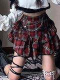 Alt fashion red plaid skirt featuring high-waisted fit and ruffle hem for a chic retro aesthetic
