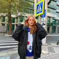 Soft acrylic blue jumper with red-eyed face print, styled for emo and grunge fashion lovers