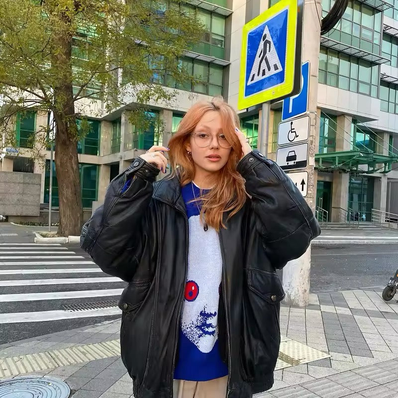 Soft acrylic blue jumper with red-eyed face print, styled for emo and grunge fashion lovers