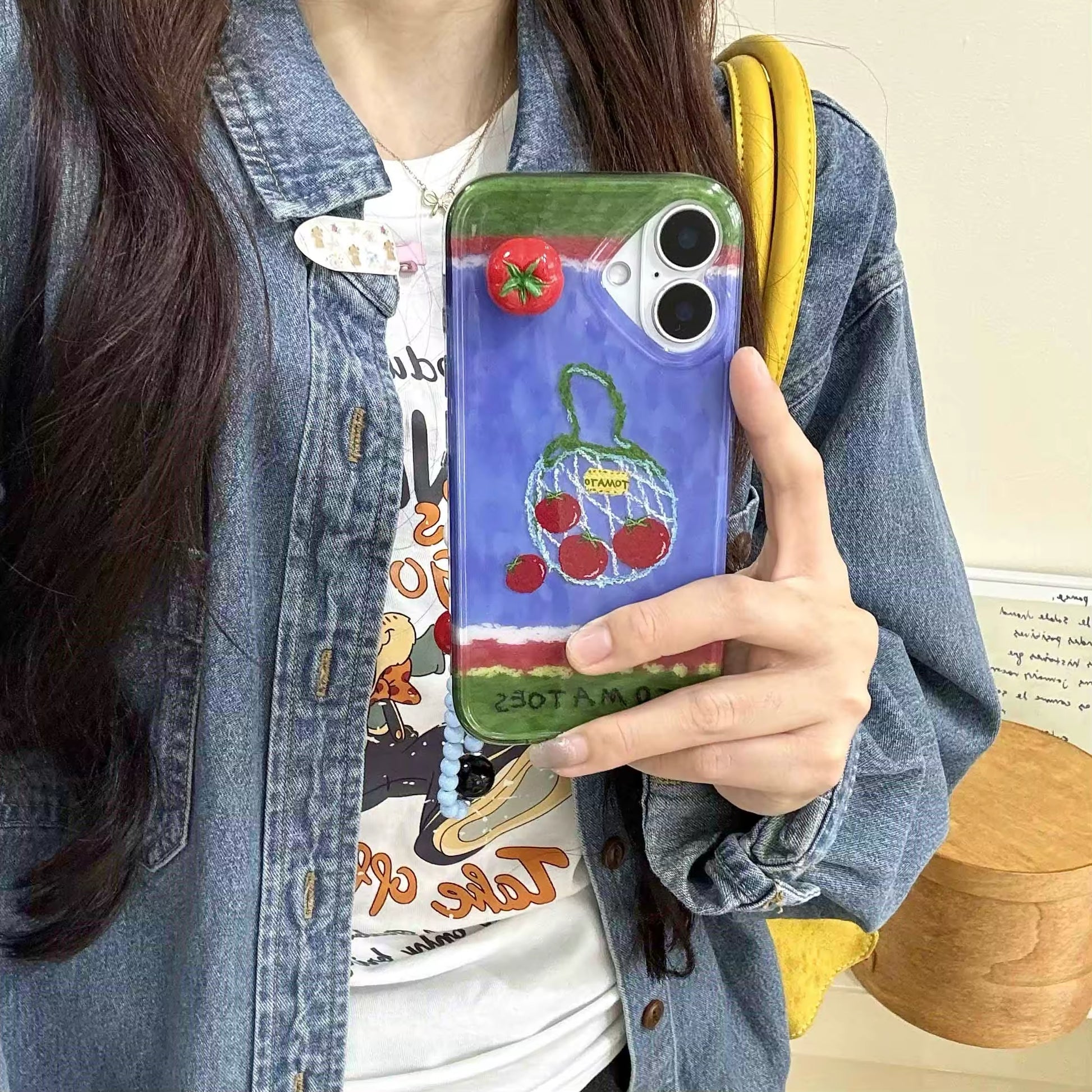The case in a flat lay with other artistic items, highlighting its unique design