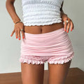 Balletcore pink ruffle shorts with elastic waist and lace trim for soft girl outfits
