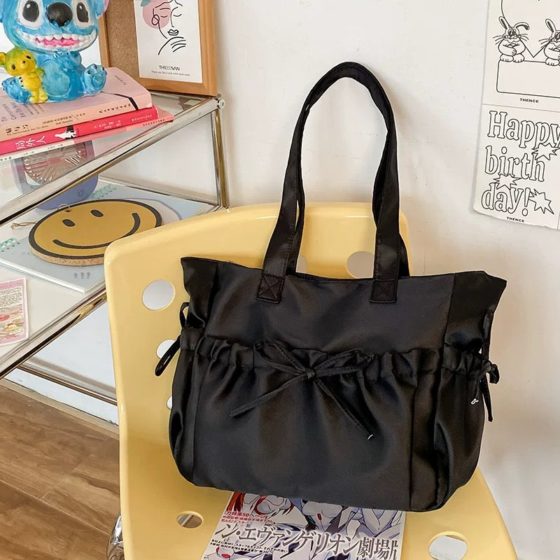 Balletcore aesthetic handbag in black satin with pleated design