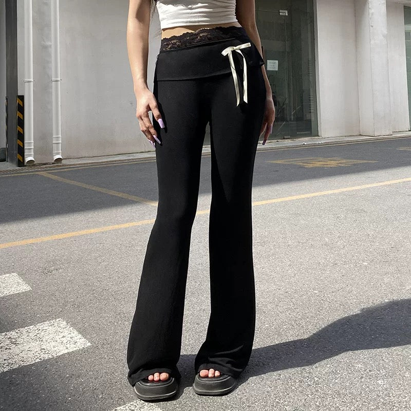 Balletcore-inspired lace patchwork flare pants, Y2K aesthetic low-waisted bootcut trousers with contrast bow details, perfect for Pilates girl outfits