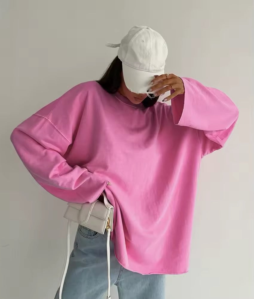Basic pink long sleeve tee on model styled with white jeans