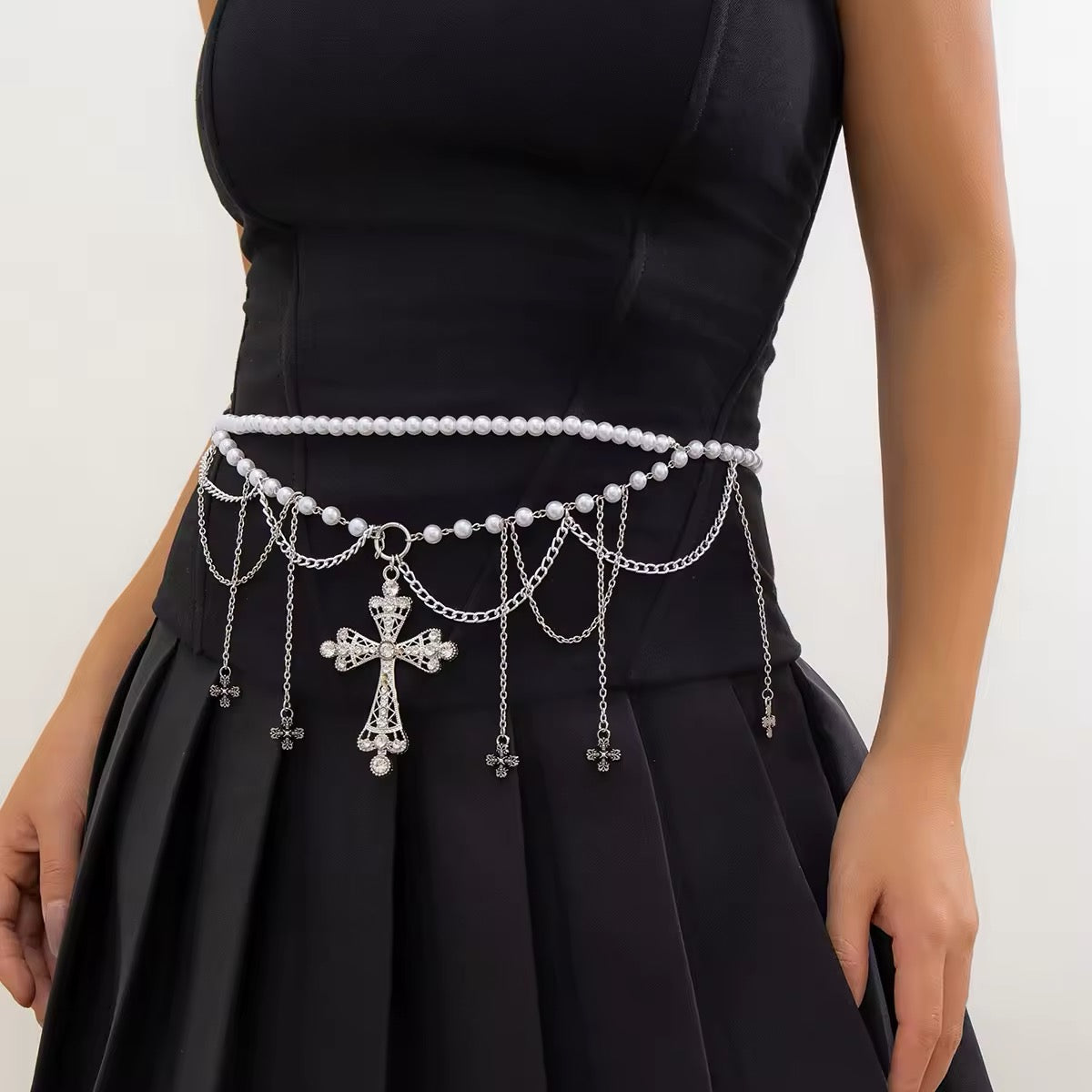 Emo girl in black outfit wearing gothic pearl body chain for edgy aesthetic