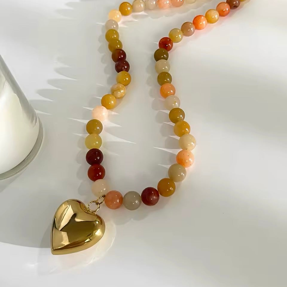 Handmade beaded chain necklace with a trendy heart pendant