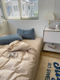 Bedroom with a bed, nightstand, and window