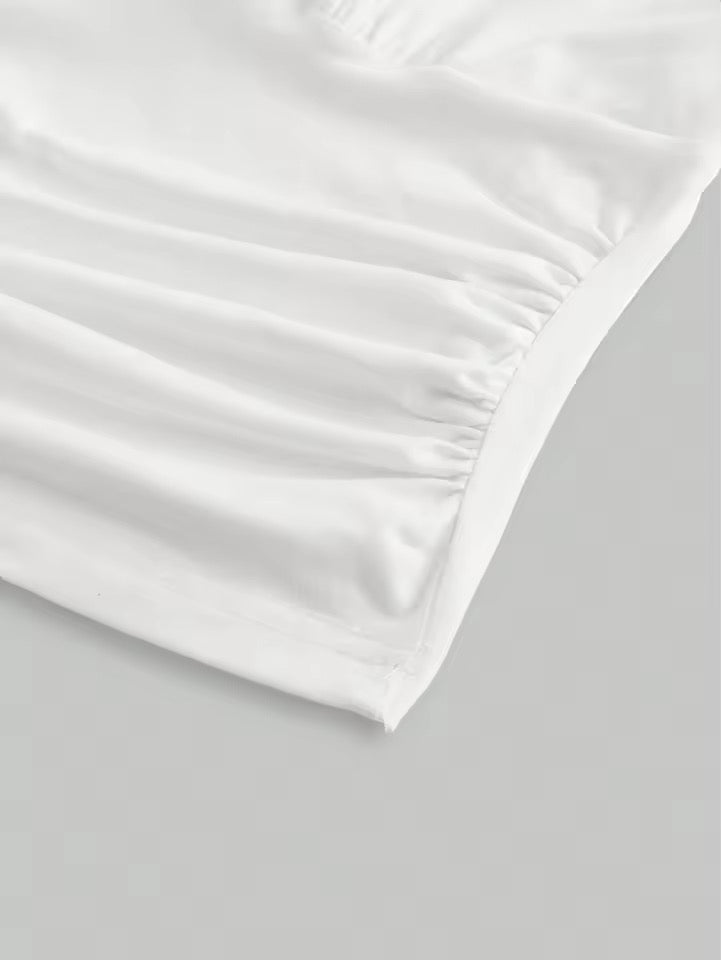 White pillowcase on a light gray background