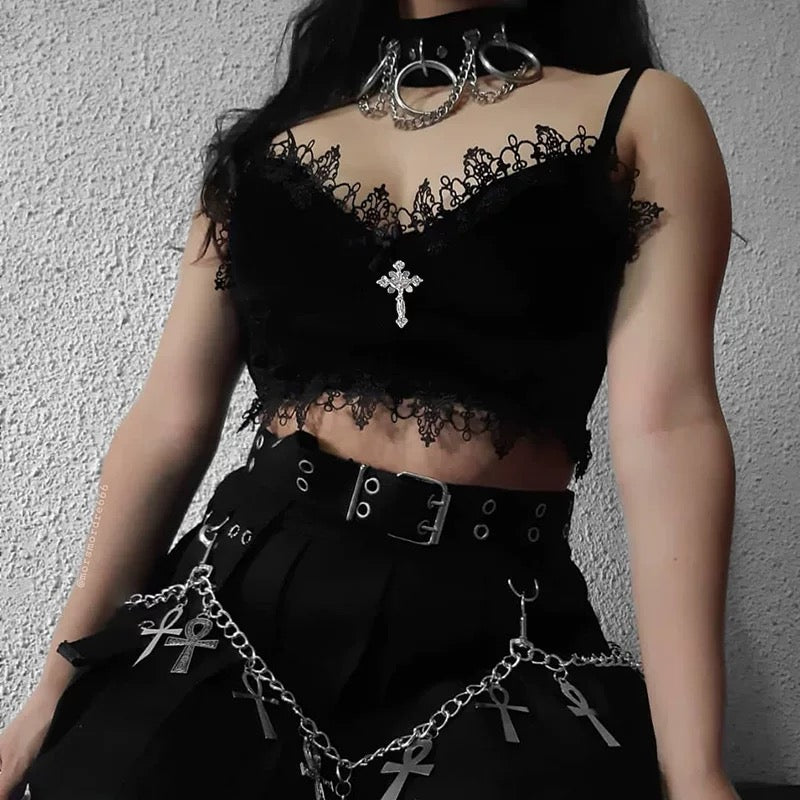 Model in gothic crop top with lace trim and straps