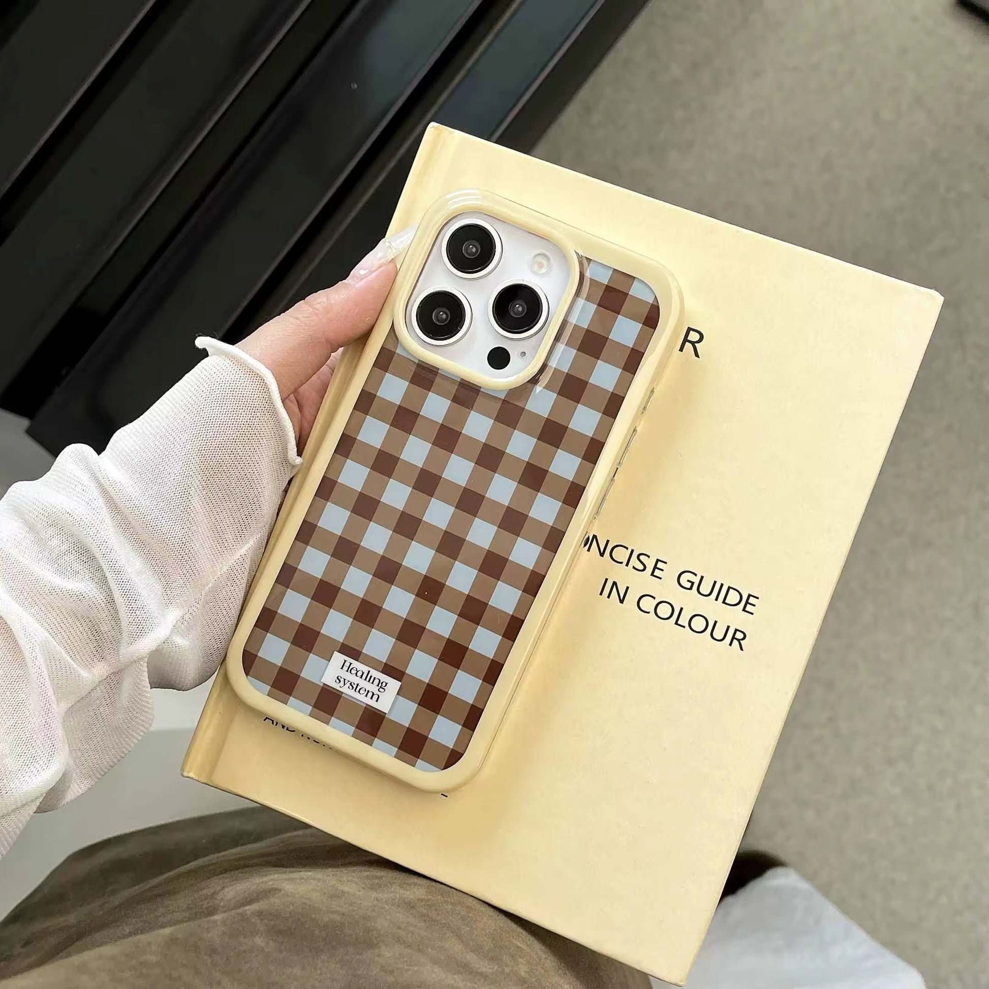 Front view of the Brown Checkered iPhone Case showcasing the retro design