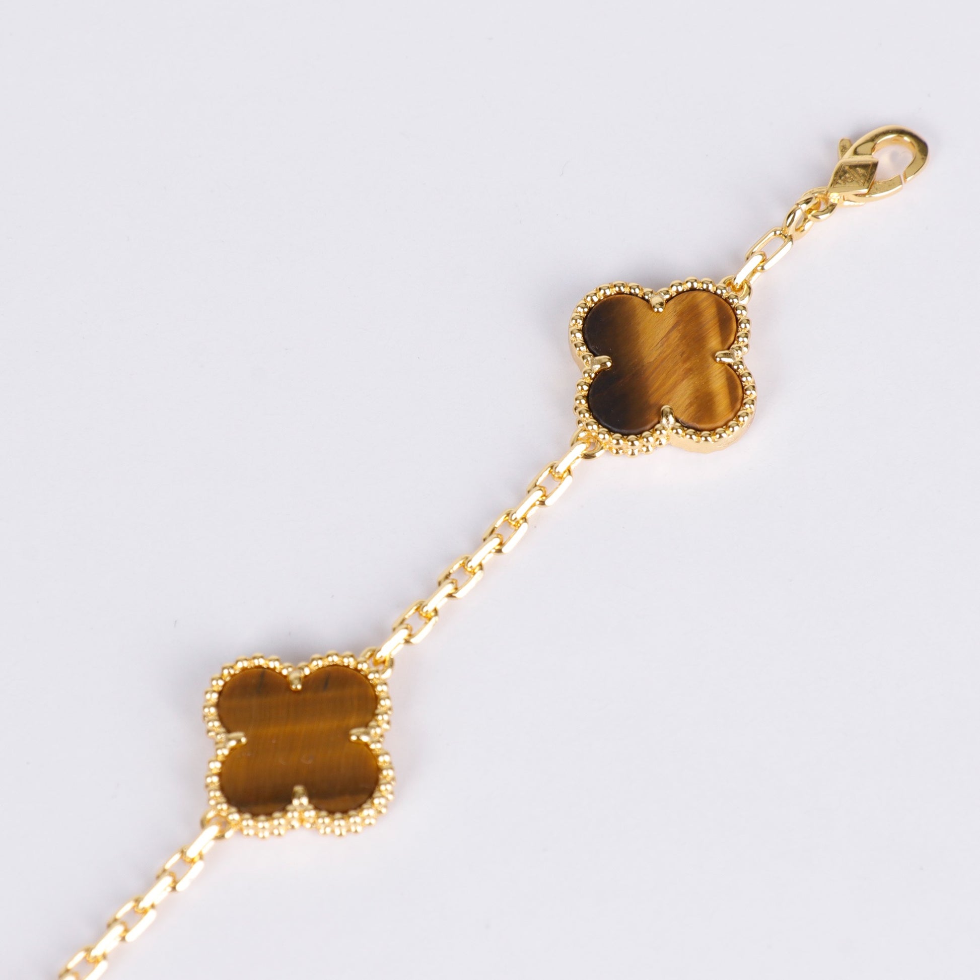 Designer bracelet with tiger eye clover and elegant finish