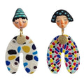 Bold asymmetrical earrings with colorful Indian cartoon faces, perfect for Y2K aesthetic streetwear and cultural style