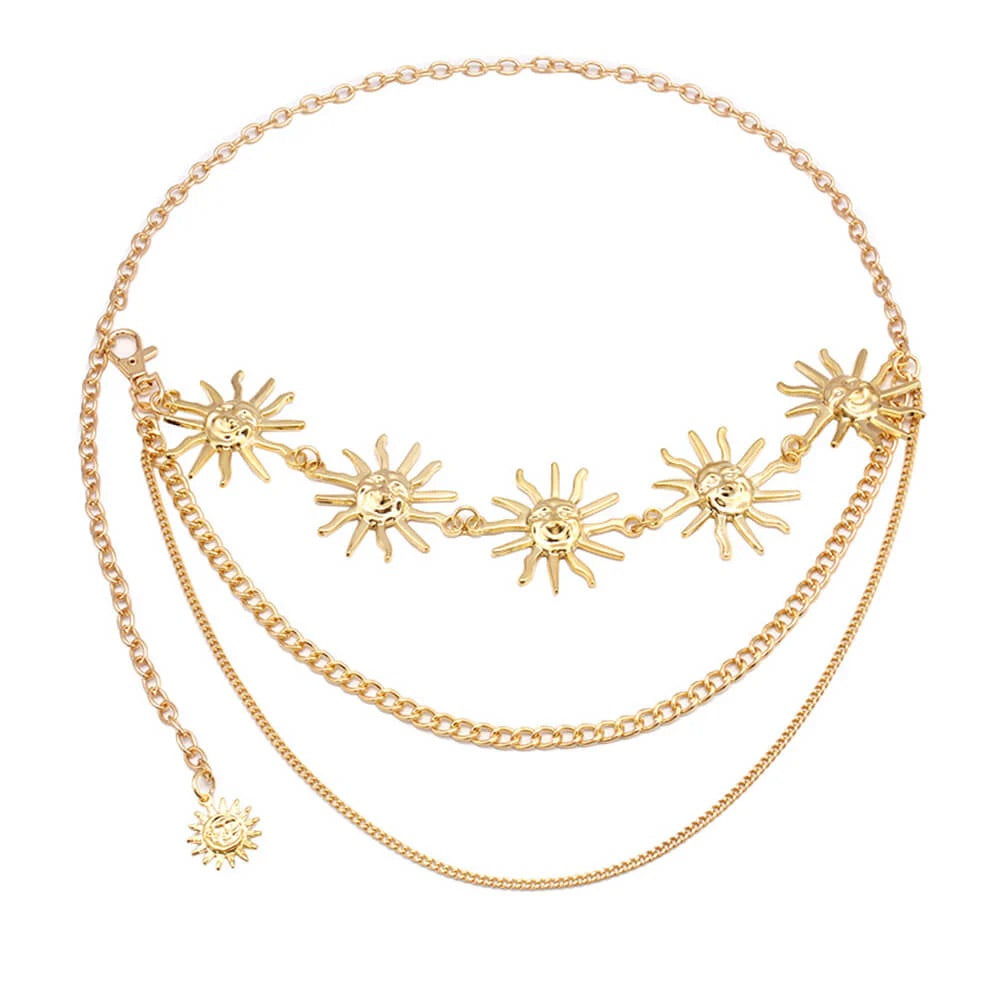 Close-up of celestial sun charm on punk-style metal waist chain