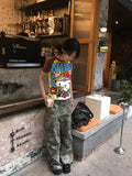 Outdoor street photo showing the kawaii top in a playful Tokyo streetwear aesthetic.