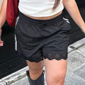 Comfortable loose-fit shorts for women with Y2K sporty vibe
