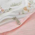 Pink floral duvet cover set styled in a cozy cottagecore bedroom with soft pastel decor accents
