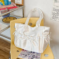 Coquette satin shoulder bag in pink with bow and zipper