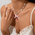 Coquette strawberry necklace with bowknot pendant in pink and white