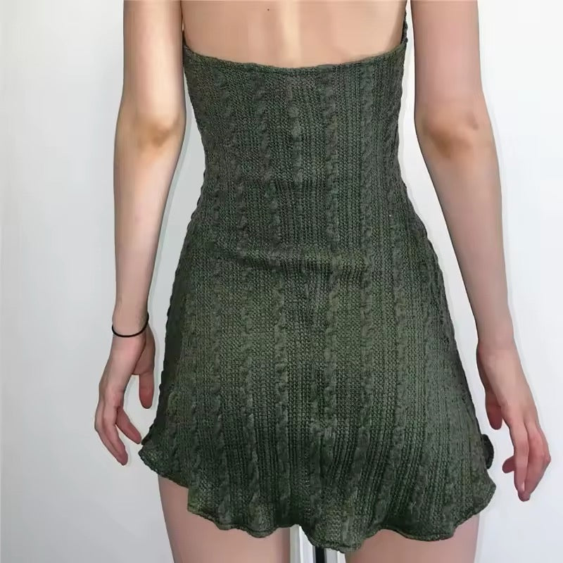Model wearing vintage halter mini dress in casual retro style