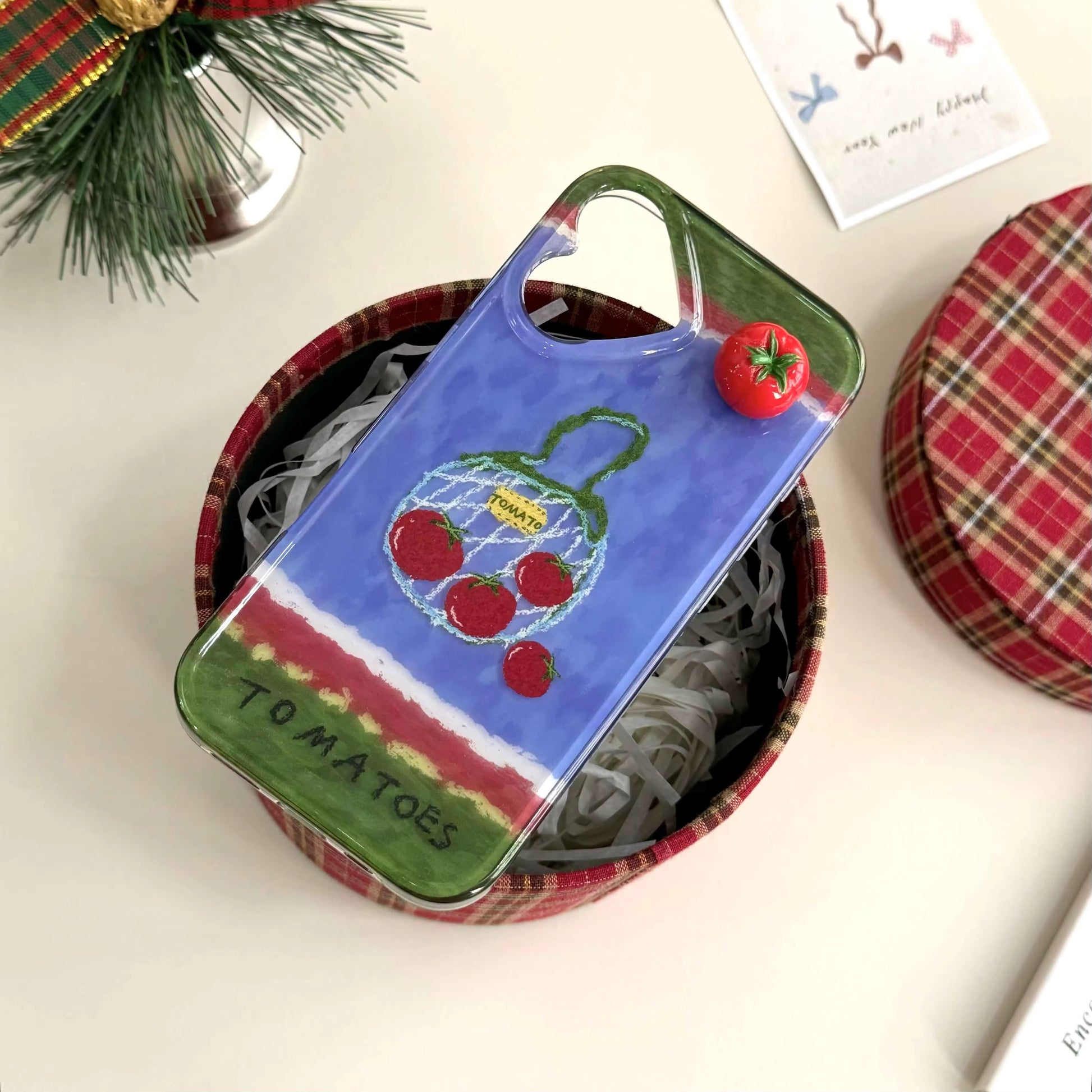 The case displayed on a rustic wooden table, complementing the cottagecore aesthetic