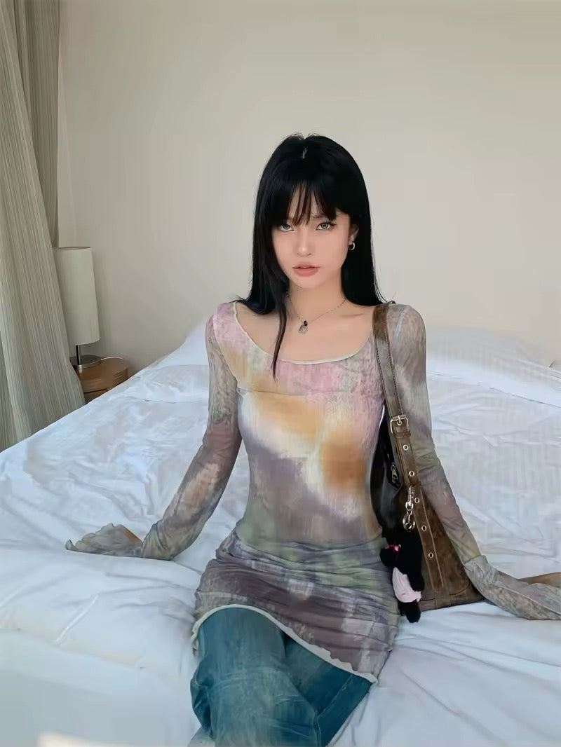 Close-up of the hemline, featuring subtle lettuce-edge detailing.