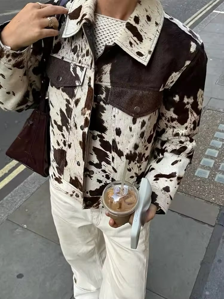 Vintage-inspired cow print jacket for women with irregular black and white pattern, cropped wool coat design for autumn and winter fashion