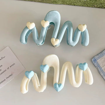 Cream-colored aesthetic shark clip for ponytails