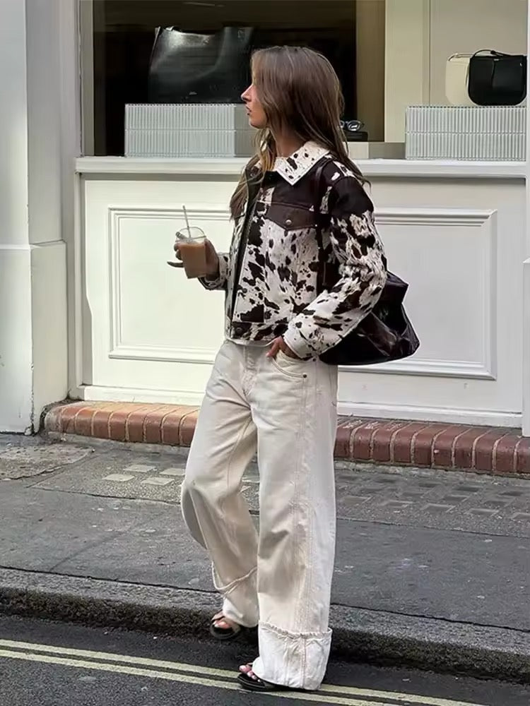 Vintage-inspired cow print jacket for women with irregular black and white pattern, cropped wool coat design for autumn and winter fashion