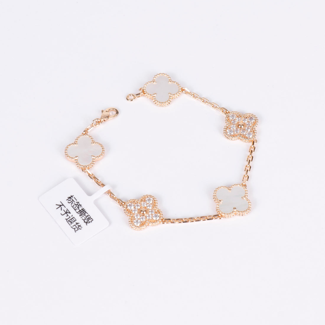 Lucky charm bracelet with sparkling white pearl accents