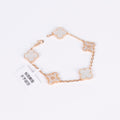 Crystal pearl clover bracelet in 18K gold with white enamel charm