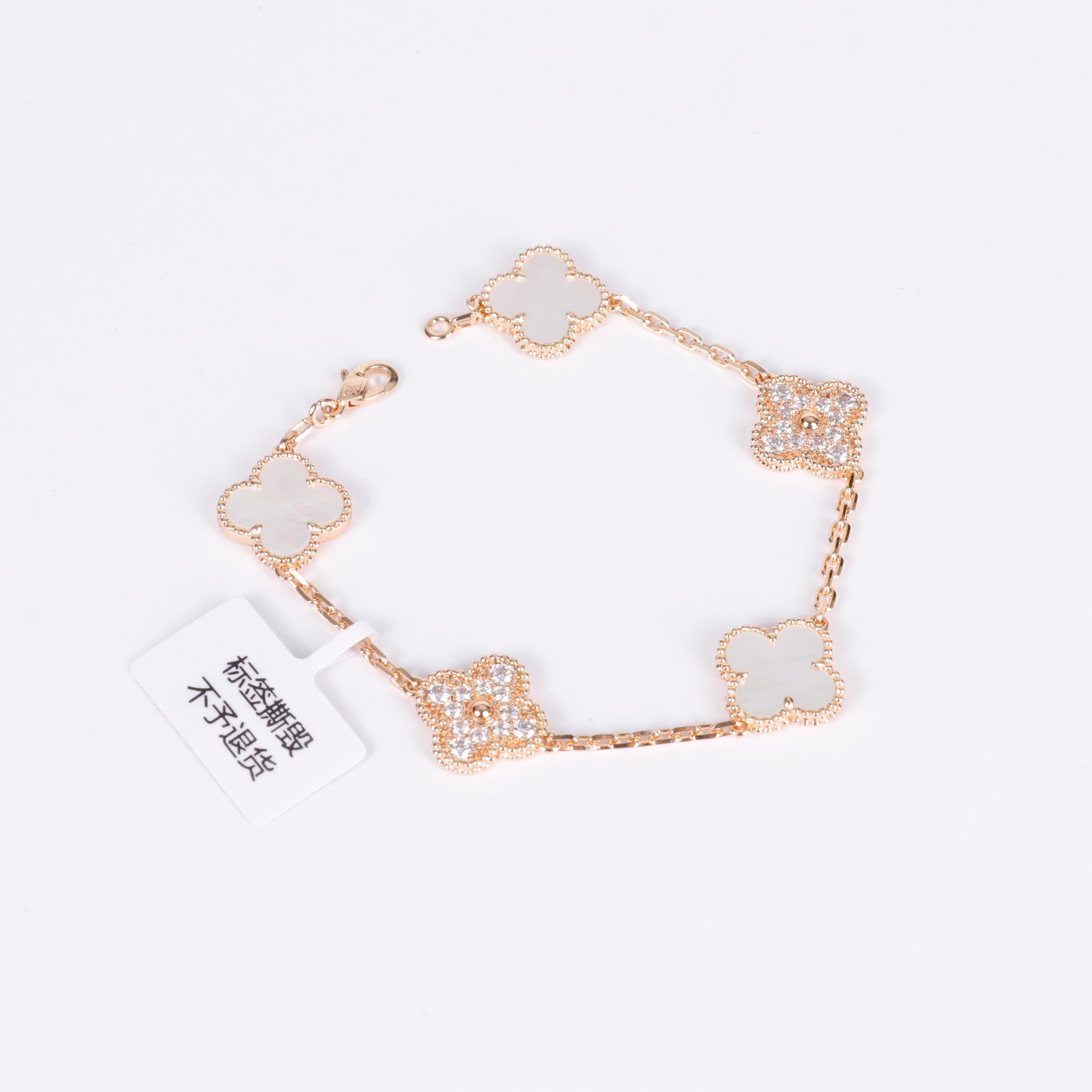 Crystal pearl clover bracelet in 18K gold with white enamel charm