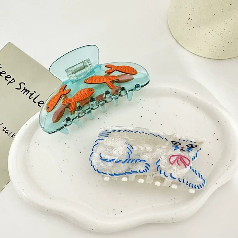 Trendy Persian cat & fish hair claw for quirky hairstyles
