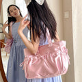 Pink satin handbag styled with coquette outfit