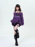 Oversized distressed grunge knitwear with bold lettering and graphics