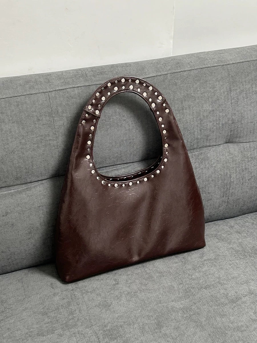 Soft leather shoulder bag with wide opening and strong handles