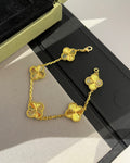 18K gold bracelet featuring symbolic four-leaf clover design